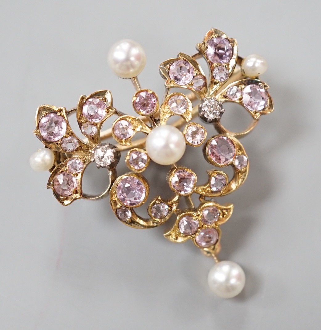An early 20th century yellow metal, diamond, cultured pearl and pink topaz? cluster set pendant brooch, width 30mm, gross weight 9.1 grams.